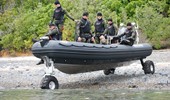 7.1m commercial RIB and military driving into river