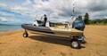 Gold Sealegs 7.5m RIB amphibious boat on the sand